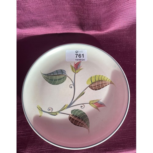 761 - Midwinter Pottery, England features a hand-painted serving plate. This plate holds a floral motif wi... 