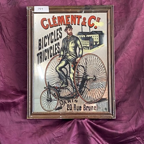 789 - A 20th century advertising mirror depicting a gentleman with a tricycle for Clement & Co. Paris / Al... 