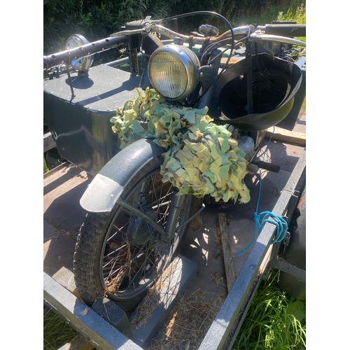 911 - A movie prop motorbike and sidecar, created to replicate a German motorcycle, complete with trailer,... 