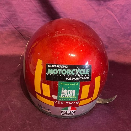 856 - Vintage AGV motorcycle helmet, red with Italian flag decal. It has a clear visor and rear motorcycle... 