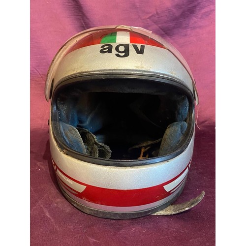 856 - Vintage AGV motorcycle helmet, red with Italian flag decal. It has a clear visor and rear motorcycle... 