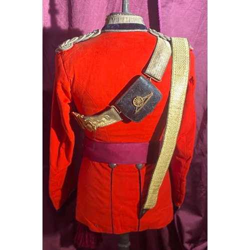 722 - Victorian British military dress tunic from in bright red with gold braid detailing and decorative b... 