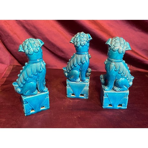 861 - Set of three early 20th century turquoise ceramic Foo Dog statues with glaze finish. Traditional gua... 