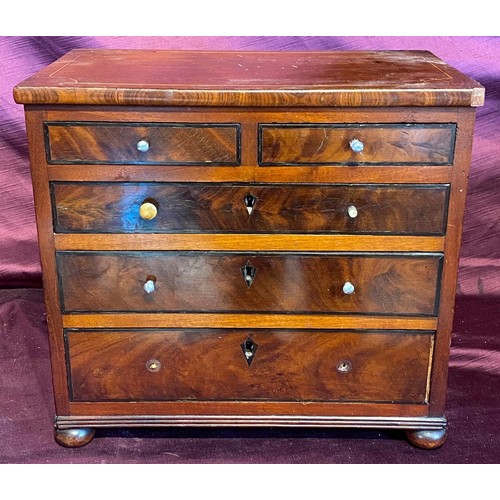 473 - A fine quality 19th century apprentice chest, a miniature set of two over three graduated drawers wi... 