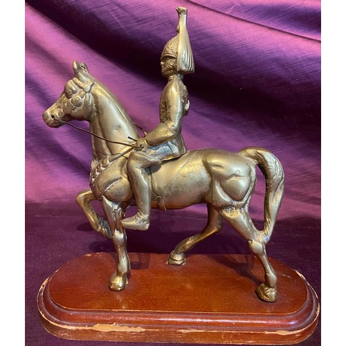 561 - A 20th century brass casting of a Dragoon on horseback, on wooden base, 25 x 24 x 11cm / All lots ar... 