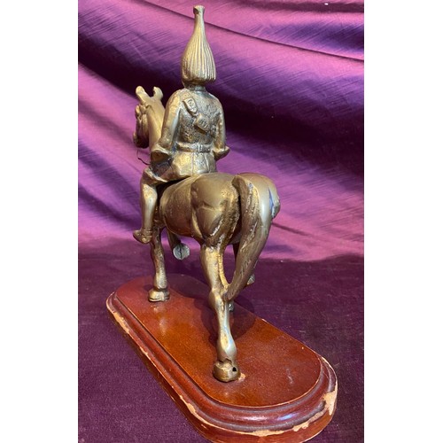 561 - A 20th century brass casting of a Dragoon on horseback, on wooden base, 25 x 24 x 11cm / All lots ar... 