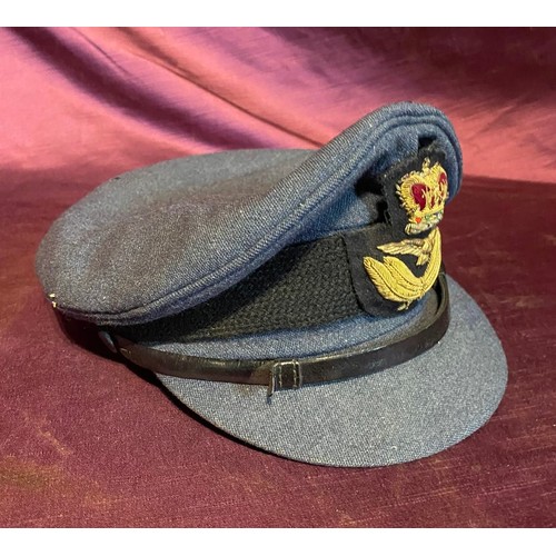 676 - A mid-20th century RAF officers peaked hat / All lots are located at The Barn, Hampstead Farm, Nr He... 