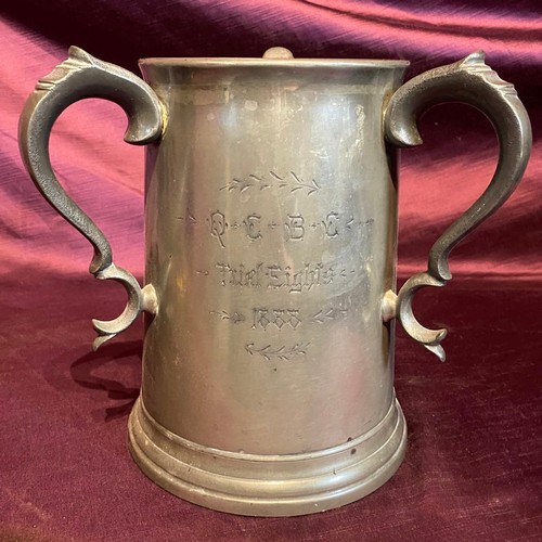 685 - A 19th century tri-handled presentation rowing tankard, dated 1888, in pewter / All lots are located... 