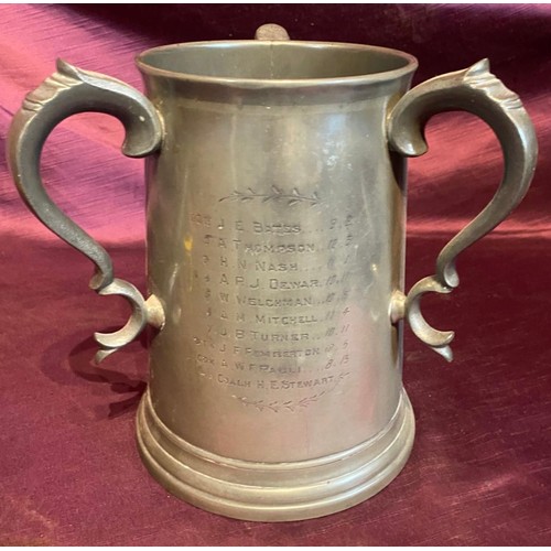 685 - A 19th century tri-handled presentation rowing tankard, dated 1888, in pewter / All lots are located... 