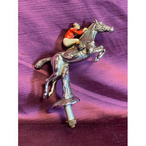 917 - Early 20th century car mascot in the form of a leaping hurdle jockey on horseback, bronze hand paint... 