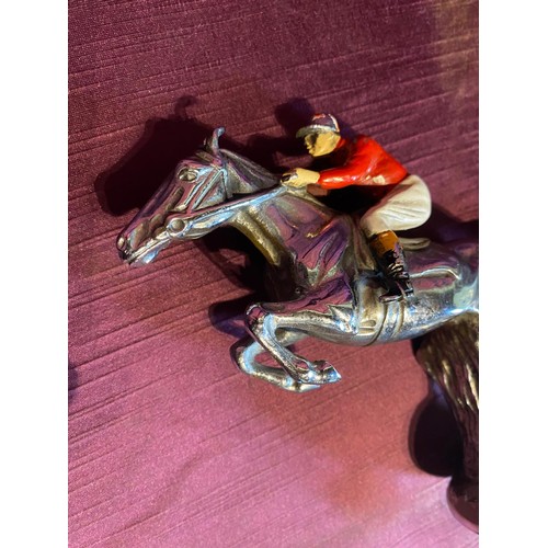 917 - Early 20th century car mascot in the form of a leaping hurdle jockey on horseback, bronze hand paint... 