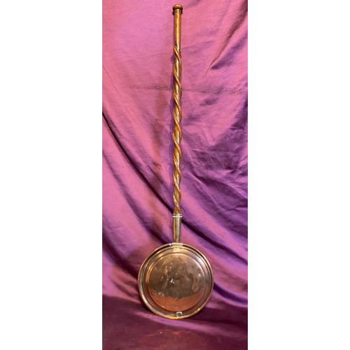 923 - A copper warming pan, however has been adapted with a very finely carved rope twist walking stick / ... 