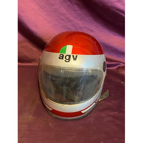 856 - Vintage AGV motorcycle helmet, red with Italian flag decal. It has a clear visor and rear motorcycle... 