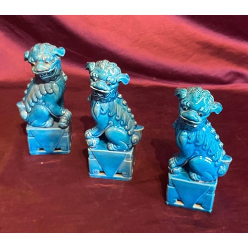 861 - Set of three early 20th century turquoise ceramic Foo Dog statues with glaze finish. Traditional gua... 