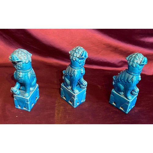 861 - Set of three early 20th century turquoise ceramic Foo Dog statues with glaze finish. Traditional gua... 