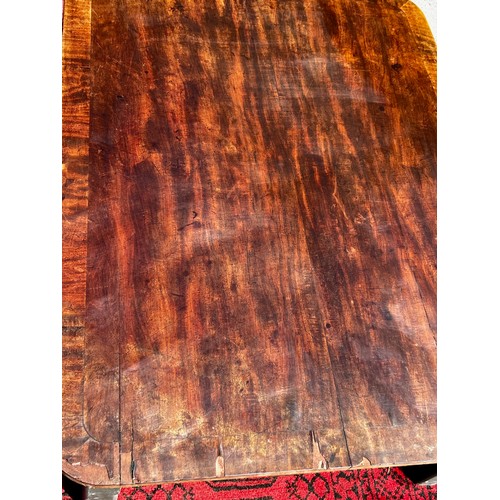 512 - A flame mahogany topped coffee table, created from reclaimed elements with painted pine four legged ... 