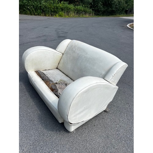 519 - Original art deco three seater sofa and two chairs, in leatherette upholstery, seat requiring recove... 