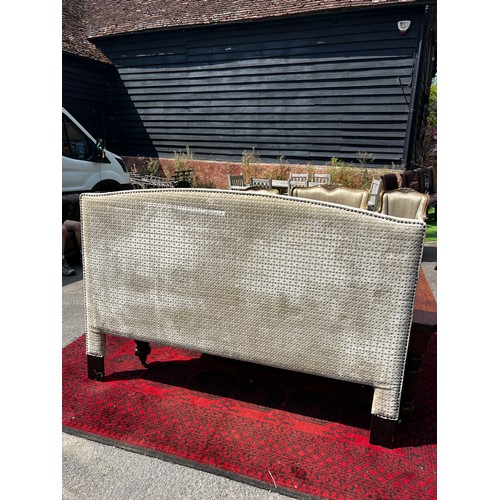 516 - A super king sized upholstered headboard with stud detailing / All lots are located at The Barn, Ham... 