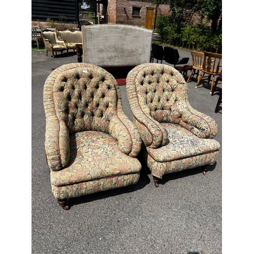 517 - A pair of late 19th century wire backed armchairs, fully buttoned on turned feet and casters / All l... 