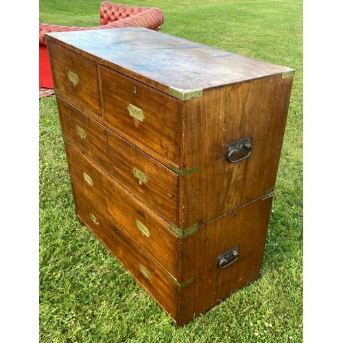 699 - A first qtr. 19th century military campaign chest of two parts, full brass bound with unusual shaped... 