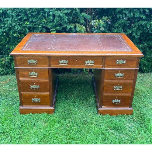 702 - A mid-19th century twin pedestal desk in walnut with separate top having three sectional tooled leat... 