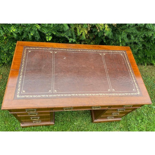 702 - A mid-19th century twin pedestal desk in walnut with separate top having three sectional tooled leat... 