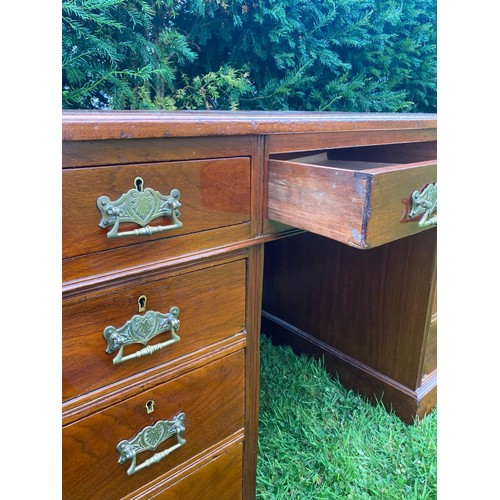 702 - A mid-19th century twin pedestal desk in walnut with separate top having three sectional tooled leat... 