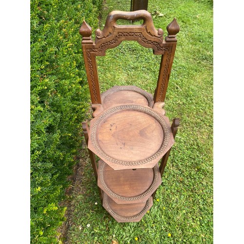 705 - A c.1900 far eastern collapsible tea and cake stand in teak / All lots are located at The Barn, Hamp... 