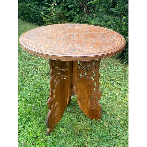 707 - A brass inlaid Middle Eastern foldaway tea table / All lots are located at The Barn, Hampstead Farm,... 