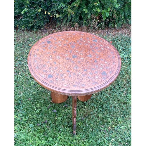 707 - A brass inlaid Middle Eastern foldaway tea table / All lots are located at The Barn, Hampstead Farm,... 