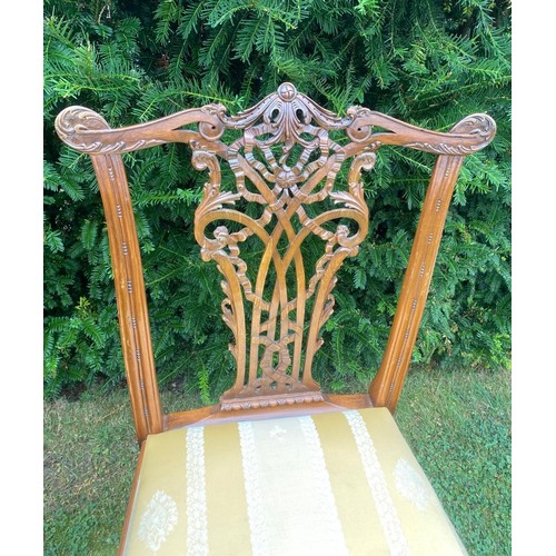 713 - A set of six 20th century Chippendale style ribbon backed dining chairs, with gold upholstered drop-... 