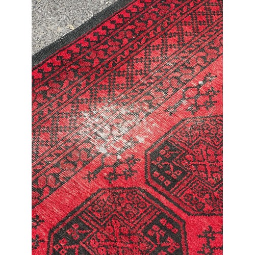 716 - A very large 19th century Persian rug, slightly worn in areas / All lots are located at The Barn, Ha... 