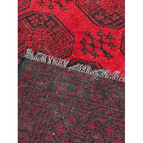 716 - A very large 19th century Persian rug, slightly worn in areas / All lots are located at The Barn, Ha... 