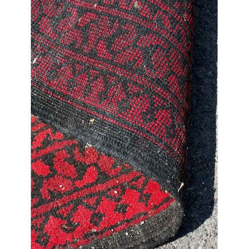 716 - A very large 19th century Persian rug, slightly worn in areas / All lots are located at The Barn, Ha... 