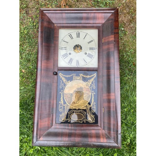 937 - An American flamed mahogany wall clock / All lots are located at The Barn, Hampstead Farm, Nr Henley... 