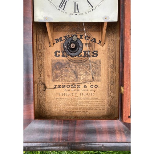 937 - An American flamed mahogany wall clock / All lots are located at The Barn, Hampstead Farm, Nr Henley... 