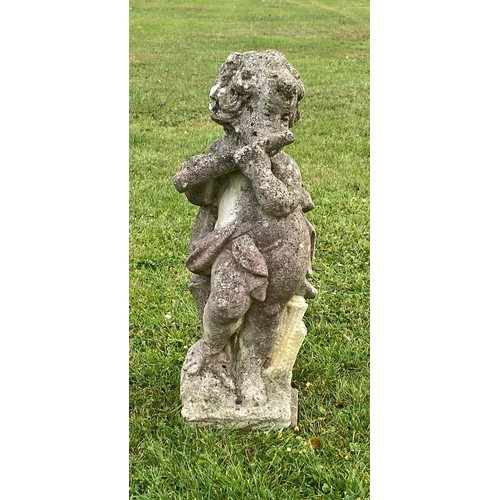 939 - A 20th century composition stone cherub statue blowing a pipe / All lots are located at The Barn, Ha... 