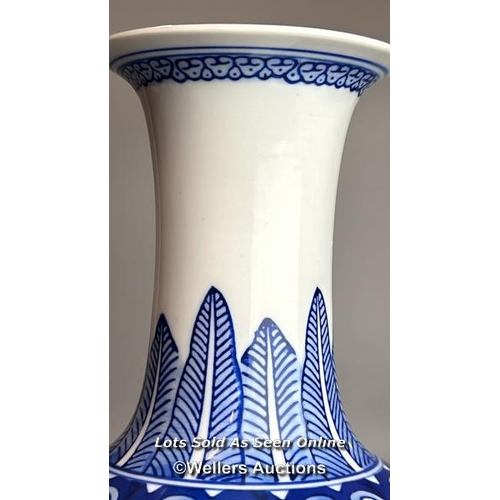 6 - A pair of Chinese blue & white Qianglong-style lotus design bottle vases, one slightly taller than t... 