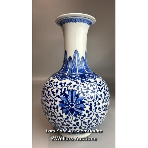 6 - A pair of Chinese blue & white Qianglong-style lotus design bottle vases, one slightly taller than t... 