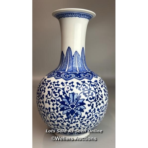 6 - A pair of Chinese blue & white Qianglong-style lotus design bottle vases, one slightly taller than t... 