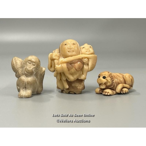 20 - Two carved tagua nut netsukes one in the form of a mother and child, 4.5cm high, the other in the fo... 