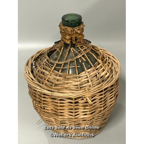 30 - Antique French olive oil jar in woven basket, with enamel label, 33cm high