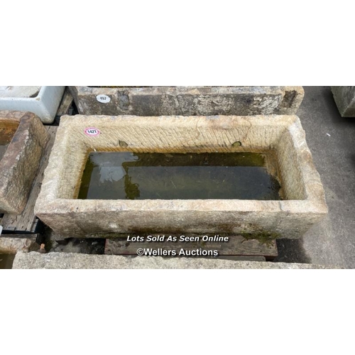 695 - A large gritstone quarry trough, 45 h x 170 l x 76cm w