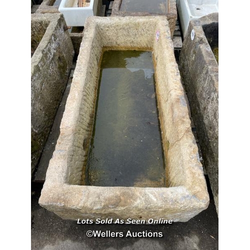 695 - A large gritstone quarry trough, 45 h x 170 l x 76cm w