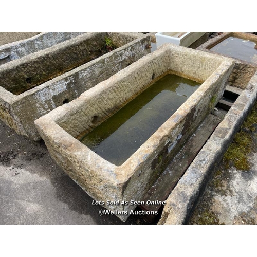 695 - A large gritstone quarry trough, 45 h x 170 l x 76cm w