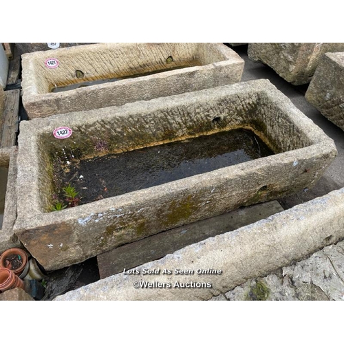 696 - A large gristone quarry trough, 45 h x 170 l x 76cm w