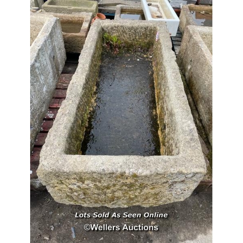 696 - A large gristone quarry trough, 45 h x 170 l x 76cm w