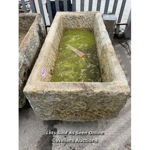 697 - A large gristone quarry trough, 45 h x 170 l x 76cm w