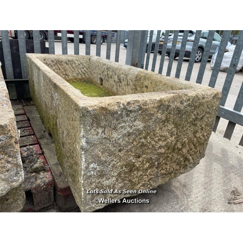 697 - A large gristone quarry trough, 45 h x 170 l x 76cm w