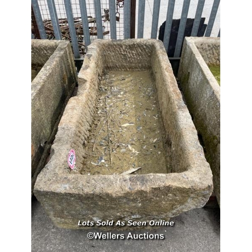 698 - A large gristone quarry trough, 45 h x 170 l x 76cm w